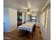 Bright dining room features a ceiling fan, built-in cabinets, and a large window, creating an inviting space at 120 N Val Vista Dr # 151, Mesa, AZ 85213