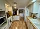 Efficient kitchen layout with modern appliances and ample cabinet space, providing functionality and convenience at 120 N Val Vista Dr # 151, Mesa, AZ 85213