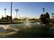 Scenic water feature with fountains and lush landscaping in a tropical-style community at 120 N Val Vista Dr # 151, Mesa, AZ 85213