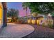 Backyard patio featuring desert landscaping, pavers, and a wrought iron fence at 1260 E Sweet Citrus Dr, Queen Creek, AZ 85140