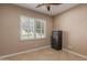 This bedroom offers natural light from the window and secure storage with a Fort Knox safe at 1260 E Sweet Citrus Dr, Queen Creek, AZ 85140
