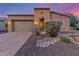 Charming single-Gathering home with a well-manicured front yard and a two-car garage at 1260 E Sweet Citrus Dr, Queen Creek, AZ 85140