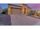 Beautiful home featuring a paved driveway, two-car garage, and desert landscaping at 1260 E Sweet Citrus Dr, Queen Creek, AZ 85140