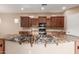 Expansive kitchen island featuring a sink and black, brown, and gold multicolored granite countertop at 1260 E Sweet Citrus Dr, Queen Creek, AZ 85140