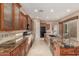 Spacious kitchen with granite countertops, stainless steel appliances, and wood cabinetry at 1260 E Sweet Citrus Dr, Queen Creek, AZ 85140
