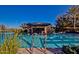 Stunning pool with a swim-up bar, creating a resort-style experience for residents at 1260 E Sweet Citrus Dr, Queen Creek, AZ 85140