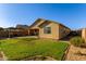 Wide view of backyard showing grass, patio, pergola, and low-maintenance landscaping at 1277 W Stephanie Ln, San Tan Valley, AZ 85143
