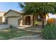 Charming single-story home featuring stone accents, a two-car garage, and desert landscaping in a sunny neighborhood at 1277 W Stephanie Ln, San Tan Valley, AZ 85143