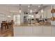 Spacious kitchen with an island, granite counters, stainless appliances, pendant lights, and a view to the dining area at 1277 W Stephanie Ln, San Tan Valley, AZ 85143