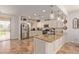 Stylish kitchen with granite countertops, stainless steel appliances, a central island, and decorative pendant lighting at 1277 W Stephanie Ln, San Tan Valley, AZ 85143