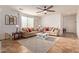Comfortable living room showcasing neutral tones, ample seating, tile flooring, and a cozy atmosphere perfect for relaxing at 1277 W Stephanie Ln, San Tan Valley, AZ 85143