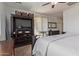Stylish bedroom featuring a bed, media center, small table with chairs and a calm atmosphere at 1277 W Stephanie Ln, San Tan Valley, AZ 85143