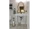 Charming bathroom with pedestal sink, decorative mirror, and stylish patterned floors at 12934 W Chapala Dr, Sun City West, AZ 85375