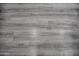 Close-up showcasing the gray luxury vinyl plank flooring at 12934 W Chapala Dr, Sun City West, AZ 85375