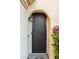 Close up of the front door of home, featuring an overhanging light at 12934 W Chapala Dr, Sun City West, AZ 85375