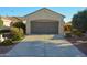 Well-maintained home featuring a spacious two-car garage and a long driveway at 12934 W Chapala Dr, Sun City West, AZ 85375