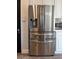 Modern kitchen featuring a stainless steel refrigerator with a built-in water dispenser at 12934 W Chapala Dr, Sun City West, AZ 85375