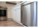 Modern kitchen with stainless steel appliances and white cabinets at 12934 W Chapala Dr, Sun City West, AZ 85375