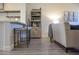 Open concept living room with seating adjacent to kitchen with countertop seating at 12934 W Chapala Dr, Sun City West, AZ 85375