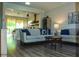 Spacious living room featuring hardwood floors and lots of natural light at 12934 W Chapala Dr, Sun City West, AZ 85375