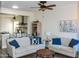 Open-concept living room featuring hardwood floors and ample seating at 12934 W Chapala Dr, Sun City West, AZ 85375