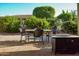 Outdoor patio features furniture with a view of the backyard landscaping at 12934 W Chapala Dr, Sun City West, AZ 85375