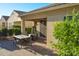 Covered patio featuring tile flooring and an outdoor dining table at 12934 W Chapala Dr, Sun City West, AZ 85375