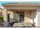 Covered patio featuring tile flooring, ceiling fan, and a heater at 12934 W Chapala Dr, Sun City West, AZ 85375
