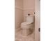 Bright bathroom featuring a classic toilet and elegant tile flooring at 12934 W Chapala Dr, Sun City West, AZ 85375