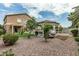 The backyard has desert landscaping, a large gazebo, and a lawn with artificial turf at 14318 N 142Nd Ln, Surprise, AZ 85379