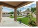 Inviting backyard featuring lush artificial grass, a gazebo, and well-manicured landscaping at 14318 N 142Nd Ln, Surprise, AZ 85379