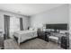 Cozy bedroom with a large window, carpet flooring, and a functional desk area at 14318 N 142Nd Ln, Surprise, AZ 85379