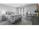 Serene bedroom with neutral tones, natural light, and plush carpet creating a relaxing atmosphere at 14318 N 142Nd Ln, Surprise, AZ 85379