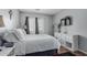 Bright bedroom with a mounted TV and white shelving, illuminated by natural light at 14318 N 142Nd Ln, Surprise, AZ 85379