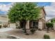 Charming two-story home featuring a well-manicured lawn, a two-car garage, and a welcoming entryway at 14318 N 142Nd Ln, Surprise, AZ 85379