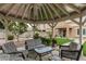 Enjoy backyard gatherings in this gazebo, complete with comfortable seating and views of the manicured lawn at 14318 N 142Nd Ln, Surprise, AZ 85379