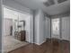 Hallway leading to bedroom and bathroom with hardwood floors and neutral paint at 14318 N 142Nd Ln, Surprise, AZ 85379