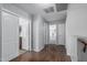 Hallway with wood floors leads to bedroom and bathroom; linen closet on left at 14318 N 142Nd Ln, Surprise, AZ 85379