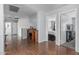 Wood-floored hallway with an open layout showing access to bedrooms and a bathroom at 14318 N 142Nd Ln, Surprise, AZ 85379