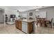 Kitchen with breakfast bar seating flows into dining and living area, great for entertaining at 14318 N 142Nd Ln, Surprise, AZ 85379