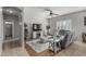 Comfortable living room with tile flooring, a ceiling fan, and a large sectional sofa for relaxation at 14318 N 142Nd Ln, Surprise, AZ 85379
