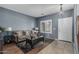 Comfortable living room with modern decor, stylish furniture, and ample natural light for a cozy atmosphere at 14318 N 142Nd Ln, Surprise, AZ 85379