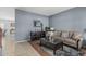 Comfortable living room with modern decor, stylish furniture, and ample natural light for a cozy atmosphere at 14318 N 142Nd Ln, Surprise, AZ 85379