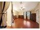 Spacious bedroom with tiled floors, ceiling fan, and lots of natural light at 15245 W Crocus Dr, Surprise, AZ 85379