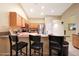 Kitchen features granite countertops, stainless steel appliances, and a breakfast bar for casual dining at 15245 W Crocus Dr, Surprise, AZ 85379