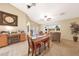Cozy living and dining area features tile flooring, comfortable seating and natural light at 15245 W Crocus Dr, Surprise, AZ 85379