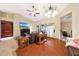 Inviting living room featuring a fireplace, media center, and comfortable seating arrangement at 15245 W Crocus Dr, Surprise, AZ 85379