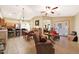 Open-concept living area with kitchen and lounge, ideal for modern living and entertaining guests at 15245 W Crocus Dr, Surprise, AZ 85379