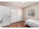 Bright bedroom with a sliding closet and window at 15424 N 52Nd Pl, Scottsdale, AZ 85254