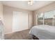 Bedroom with a sliding closet, and a window with blinds at 15424 N 52Nd Pl, Scottsdale, AZ 85254